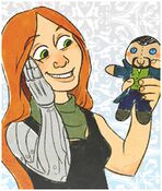 Vala holding a toy doll of Paul Denton by pirpintine